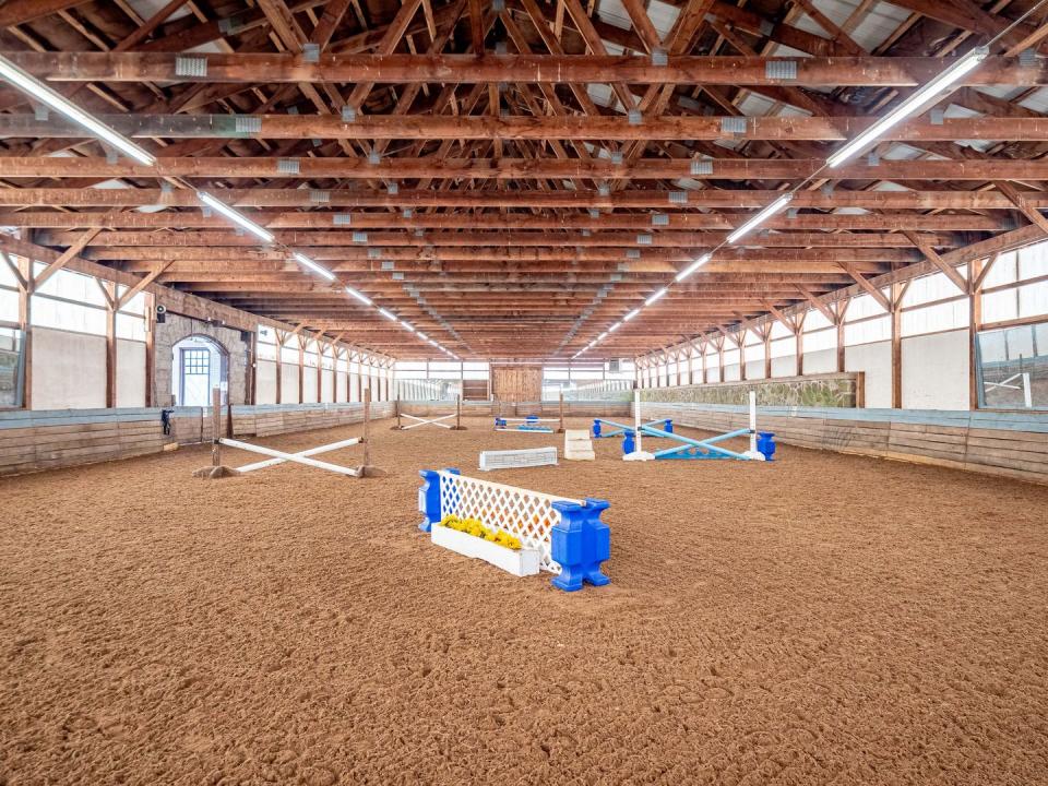 There are indoor and outdoor riding rings, a polo field, paddocks and trails.