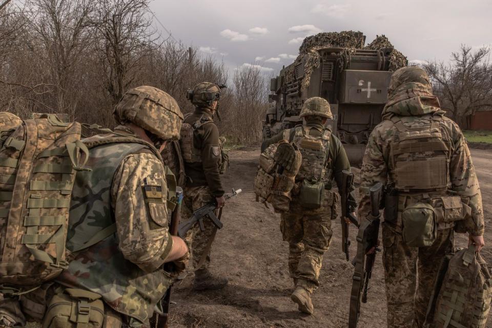 Ukrainian infantry soldiers of the 23rd Mechanized Brigade walk to board an armored fighting vehicle MaxxPro to head toward the frontline in the Avdiivka direction, in the Donetsk region, Ukraine on April 3, 2024, amid the Russian invasion of Ukraine. (Roman Pilipey /AFP via Getty Images)