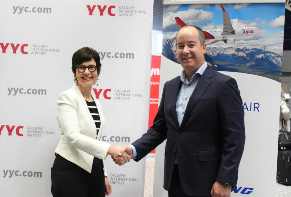 Chris Miles, Vice President, Operations &amp; Infrastructure for The Calgary Airport Authority is joined by Lynx Air CEO, Merren McArthur, to celebrate the inaugural U.S. Lynx Air flight out of Calgary International Airport.