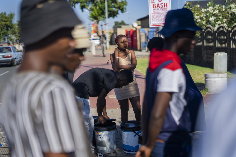 Residents of the township of Soweto, South Africa, queue for water Saturday, March 16, 2024. Thousands of South Africans are lining up for water as the country's largest city, Johannesburg, confronts an unprecedented collapse of its water system affecting millions of people. Residents rich and poor have never seen a shortage of this severity. (AP Photo/Jerome Delay)