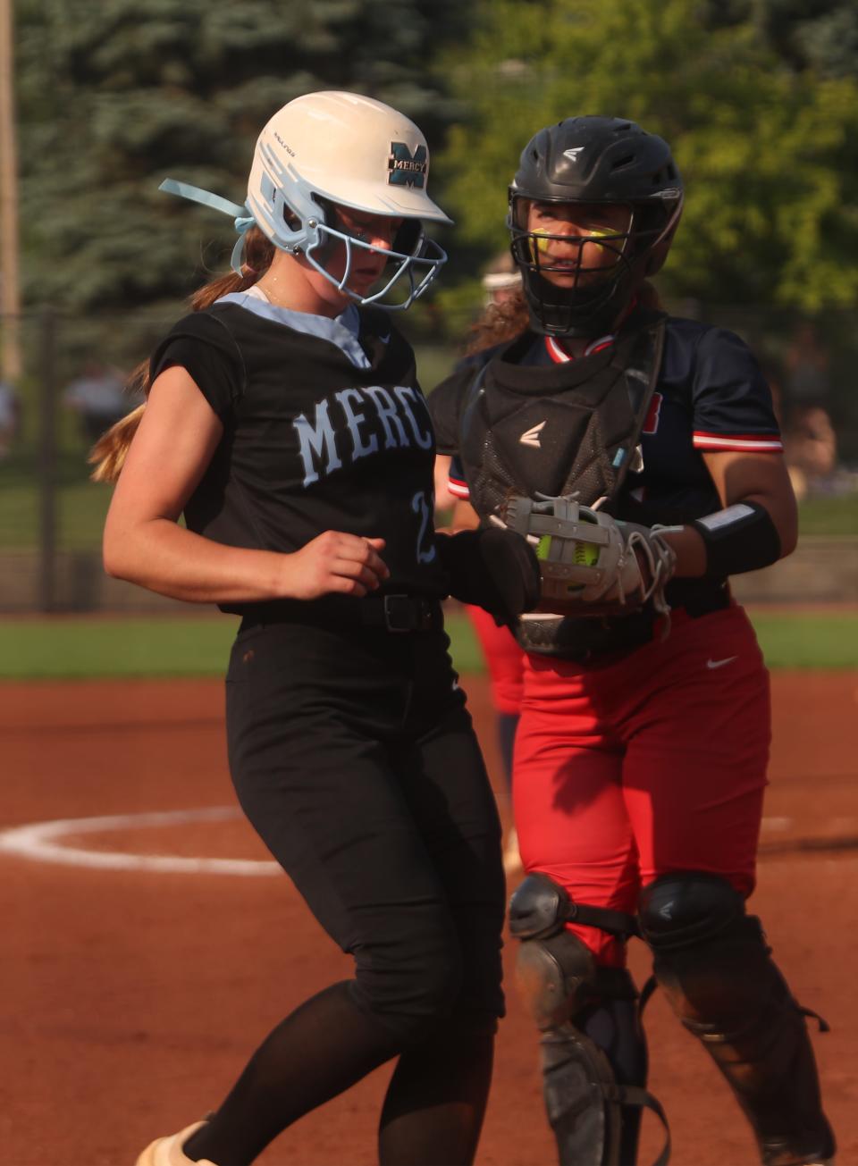 Mercy’s Ava Reinhart walks in a run against Butler’s Jenicca Alexander in the 6th Region Championship.May 23, 2023