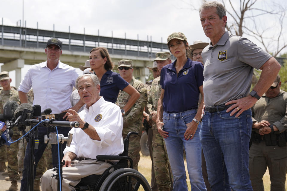 Texas Gov. Greg Abbott, center, is joined by Oklahoma Gov. Kevin Stitt, left, Iowa Gov. Kim Reynolds, second from left, South Dakota Gov. Kristi Noem, second from right, and Nebraska Gov. Jim Pollen, right, during a news conference along the Rio Grande, Monday, Aug. 21, 2023, in Eagle Pass, Texas. (AP Photo/Eric Gay)