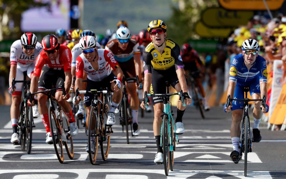 Belgium's Wout Van Aert, second from right, crosses the finish line to win the tenth stage of the Tour de France - AP