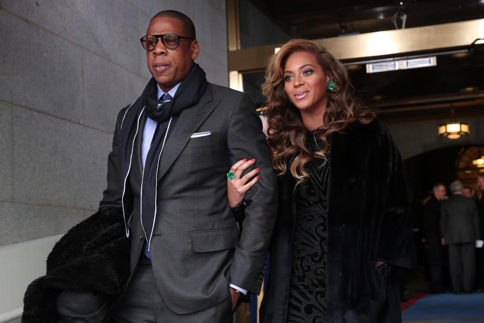 Jay-Z and Beyonce arrive at the presidential inauguration on the West Front of the U.S. Capitol January 21, 2013 in Washington, DC. Barack Obama was re-elected for a second term as President of the United States. (Photo by Win McNamee/Getty Images)