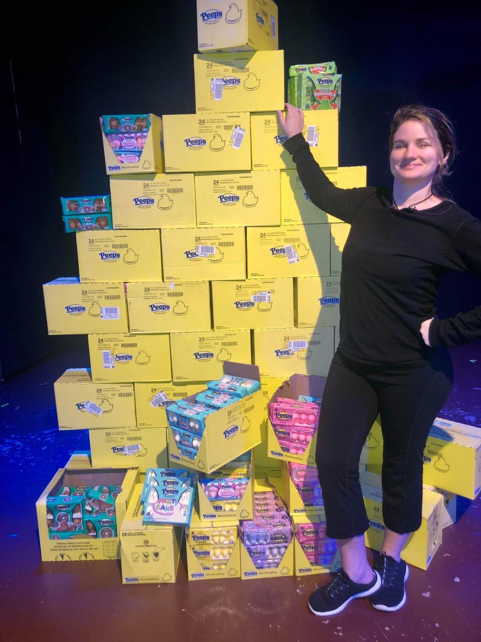 Actor and stage manager Adrial McCloud shows off a huge stack of Peeps used during Lab Theater's production of "The Birds: A Parody."