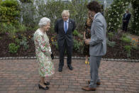 Britain's Queen Elizabeth II, left, speaks with Prime Minister Boris Johnson and Canadian Prime Minister Justin Trudeau at a reception for the G7 leaders at the Eden Project in Cornwall, England, Friday June 11, 2021, during the G7 summit. (Jack Hill/Pool via AP)