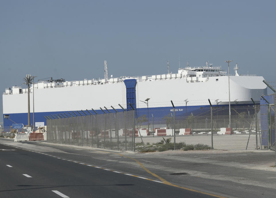 The Israeli-owned cargo ship, Helios Ray, sits docked in port after arriving earlier in Dubai, United Arab Emirates, Sunday, Feb. 28, 2021.. The ship has been damaged by an unexplained blast at the gulf of Oman on Thursday. (AP Photo/Kamran Jebreili)