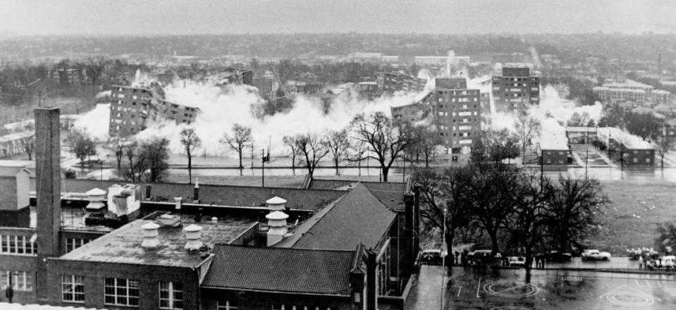Dust began forming a cloud as the Wayne Miner Court apartments were imploded in 1987. Some 34,000 tons of rubble from the five high rises was dumped on the riverfront near the Heart of America Bridge.