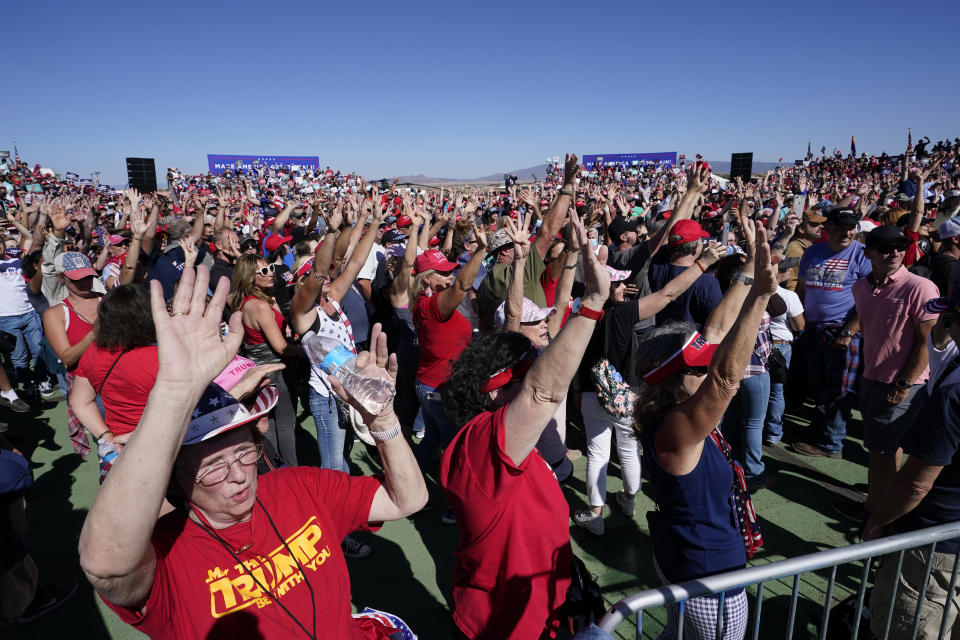 Supporters cheer as President Donald Trump speaks at a campaign rally at Prescott Regional Airport, Monday, Oct. 19, 2020, in Prescott, Ariz. (AP Photo/Alex Brandon)