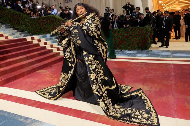 Lizzo Goes for Drama in Embroidered Coat and Brings Special Met