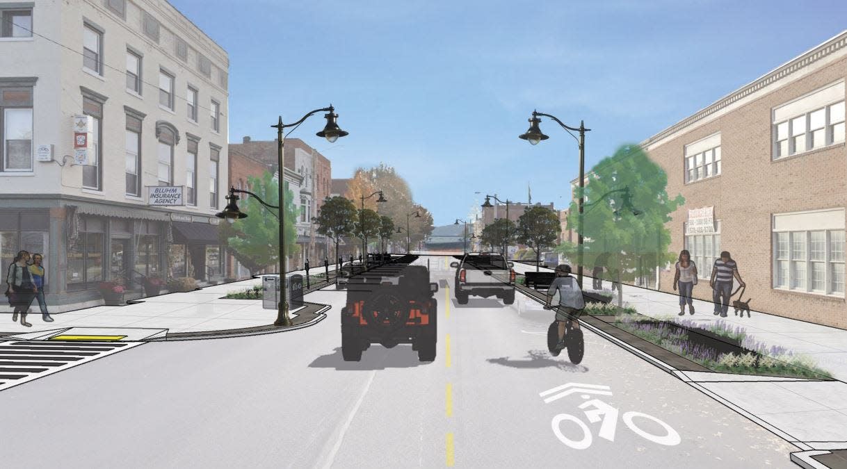 This is the latest preliminary rendering by Woodland Design Associates of the proposed design of the Main Street Streetscape plan. GHP is still in the process of having these designs reviewed by stakeholders, the borough council and the public. Details may change. This view looking south on Main Street at the corner with 9th Street, shows a pedestrian "bump out" at left, newly designed streetlamps posts and bicycle route markings. Bump outs are proposed at each intersection.