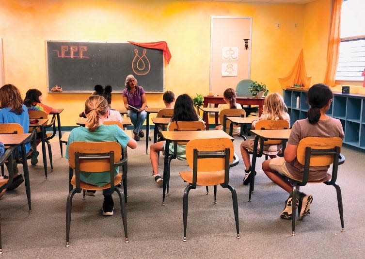 Students sit in a classroom at Constellation Charter School in Waldo, Florida. It is the first school in the town based off of Waldorf education methods.