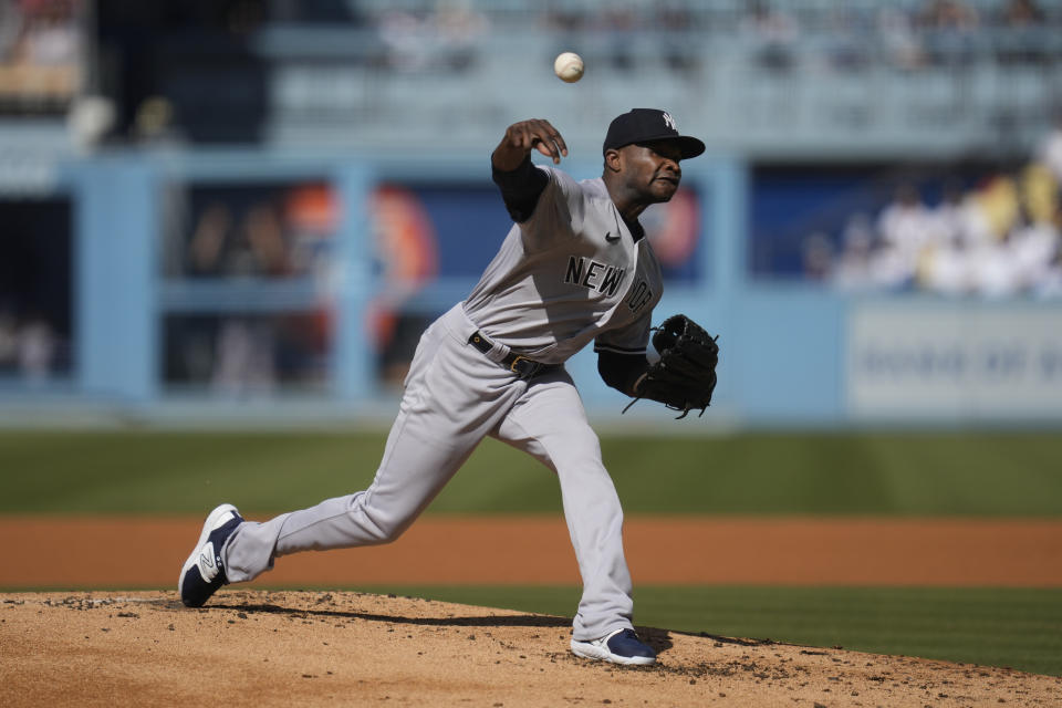 New York Yankees starting pitcher Domingo German (0) throws during the first inning of a baseball game against the Los Angeles Dodgers in Los Angeles, Sunday, June 4, 2023. (AP Photo/Ashley Landis)