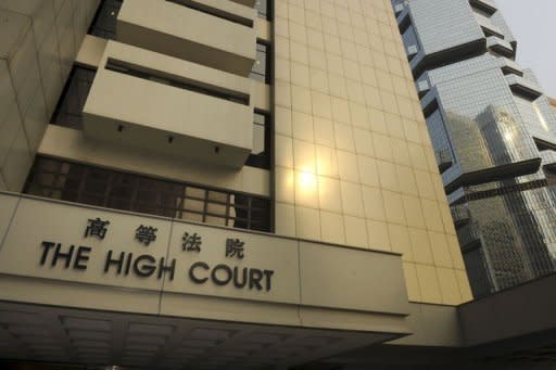 The sun reflects off the the outer wall of the High Court in Hong Kong. The High Court ruled on September 30 last year that Philippine domestic worker Evangeline Banao Vallejos had the right to request permanent residency status, something that had been denied to foreign maids until then