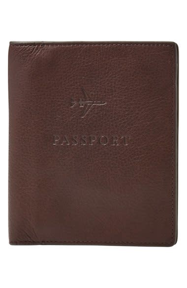<p>(Cost: $55) Every international traveler needs money, tickets, and a passport before boarding a plane. Keep all three in the same place with this <a rel="nofollow noopener" href="https://www.fossil.com/us/en/products/leather-rfid-passport-case-sku-MLG0358001C.html?cid=pds:conv:google:shopping:Fossil-Men-Accessories-Passport:male:MLG0358001&mr:trackingCode=$(ReferralID)$&mr:referralID=NA&s_kwcid=AL!4524!3!75580175579!!!g!59620263137!&ef_id=WD3WyAAABfRtuB-q:20161205193721:s" target="_blank" data-ylk="slk:leather passport case" class="link rapid-noclick-resp">leather passport case</a> from Fossil. The small wallet comes with an interior passport slot, zip pocket, slip pocket and four card slots. It also comes in three different colors (black, brown and cognac) so you can stay color coordinated and organized. </p>