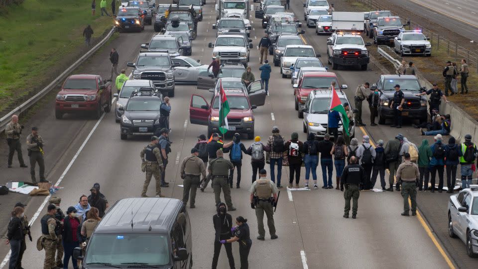 Demonstrators prevent traffic from using the southbound lanes of Interstate 5 near Eugene, Oregon. - Chris Pietsch/The Register-Guard/USA Today