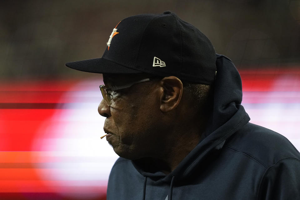 Houston Astros manager Dusty Baker Jr. watches with a toothpick in his mouth during the third inning in Game 5 of baseball's World Series between the Houston Astros and the Atlanta Braves Sunday, Oct. 31, 2021, in Atlanta. (AP Photo/David J. Phillip)