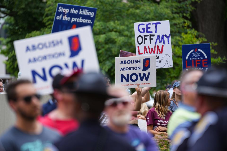 A police line separated abortion rights and anti-abortion demonstrators Saturday, June 25, 2022, at the Indiana Statehouse in Indianapolis. Remaining demonstrators from the morning's abortion rights rally approached the afternoon's anti-abortion rally, after marching the city. 