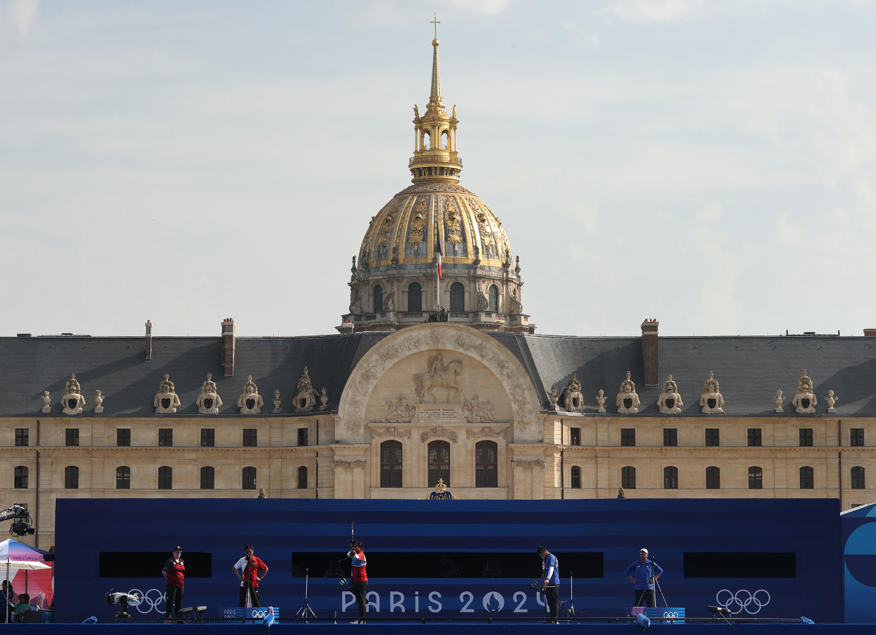 PARIS, FRANCE - JULY 30: Arif Pangestu of Team Indonesia competes during the Archery Men's Individual 1/32 contest against Chih-Chun Tang of Team Chinese Taipei on day four of the Olympic Games Paris 2024 at Esplanade Des Invalides on July 30, 2024 in Paris, France. (Photo by Julian Finney/Getty Images)