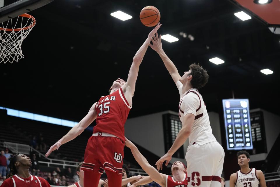 Utah center Branden Carlson (35) reaches for a rebound against Stanford during the second half of an NCAA college basketball game, Sunday, Jan. 14, 2024, in Stanford, Calif. | Godofredo A. Vásquez, Associated Press