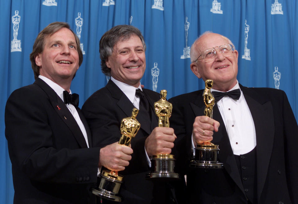 Douglas Wick, David Franzoni, and Branko Lustig, left to right, with Oscars for Best Picture of the Year for 'Gladiator,' at the 73rd Annual Academy Awards at the Shrine Auditorium in Los Angeles Sunday, March 25, 2001. Photo by Kevin Winter/Getty Images