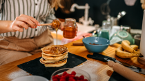 <p> Those who favour a sweet breakfast would do worse than to drizzle on a bit of honey while whipping up pancakes or porridge. There is <a href="https://bmccomplementmedtherapies.biomedcentral.com/articles/10.1186/s12906-020-03170-5" rel="nofollow noopener" target="_blank" data-ylk="slk:evidence;elm:context_link;itc:0;sec:content-canvas" class="link ">evidence</a> that the kitchen cupboard staple is rich in polyphenols, which have anti-inflammatory properties and could therefore reduce the severity of chronic inflammatory diseases - including some cancers and autoimmune conditions.  </p>