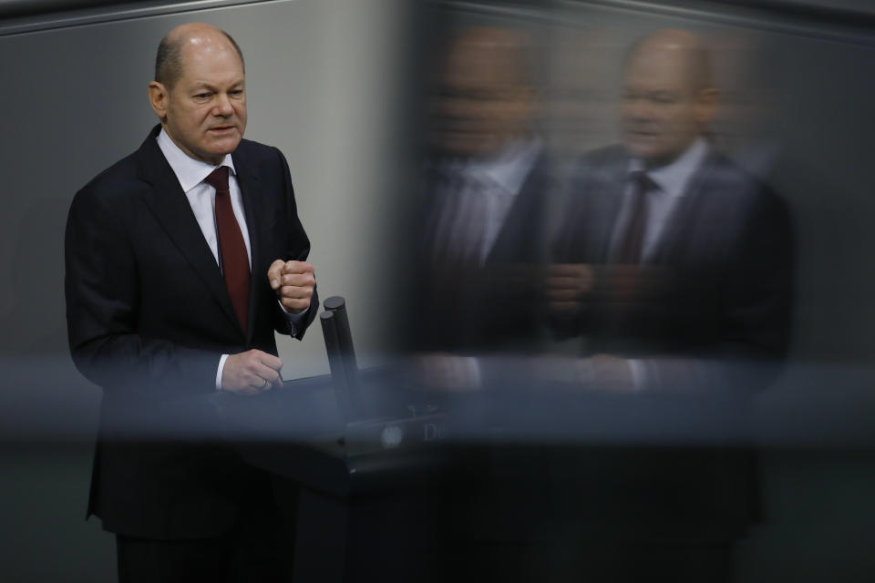 File - In this Tuesday, Dec. 8, 2020 file photo, German Finance Minister Olaf Scholz delivers his speech during the debate about Germany's budget 2021, at the parliament Bundestag in Berlin, Germany. Germany's finance minister has unveiled plans to strengthen the country's financial supervisory authority following the accounting scandal at payment systems provider Wirecard.(AP Photo/Markus Schreiber, file)