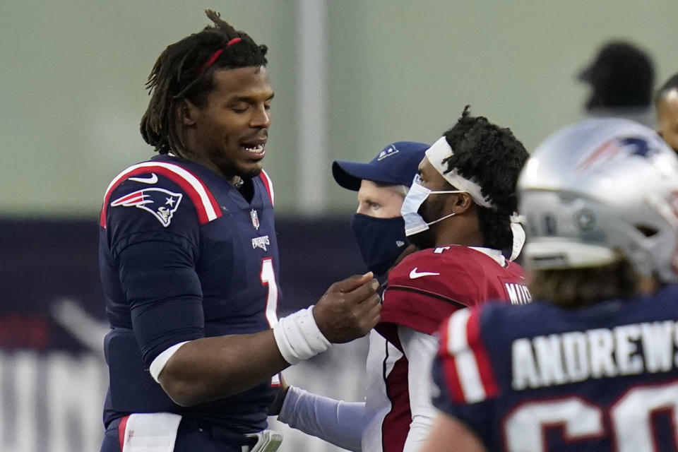 New England Patriots quarterback Cam Newton, left, and Arizona Cardinals quarterback Kyler Murray, right, speak at midfield after an NFL football game, Sunday, Nov. 29, 2020, in Foxborough, Mass. (AP Photo/Charles Krupa)