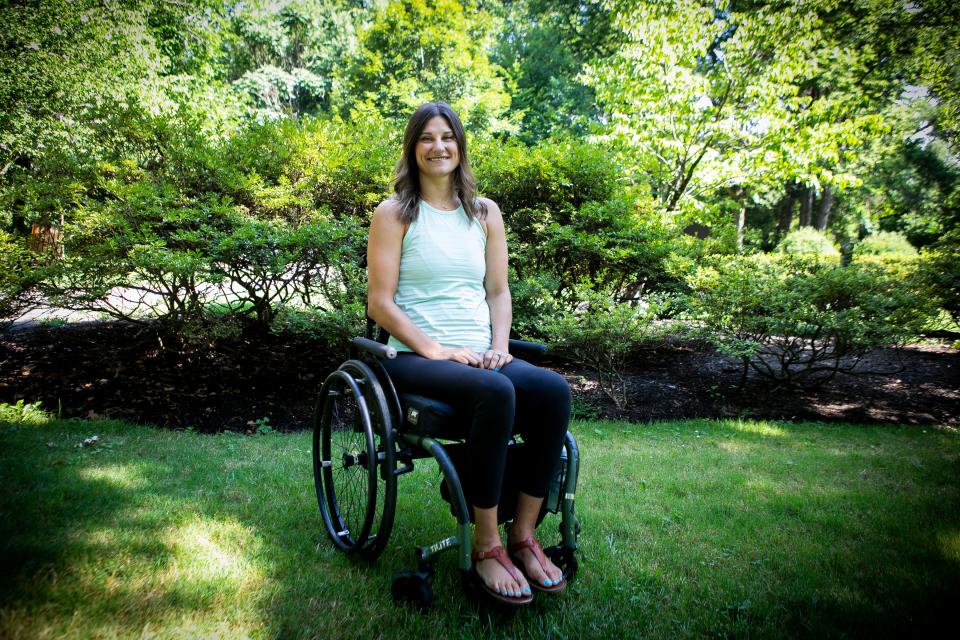 Molly Schneider, of Norwood, photographed in Lindner Park, on Monday, August 3. In 2018, Schneider fell off a 3-foot tall porch railing that left her with a spinal cord injury. She has always led a very active lifestyle and still does. On Friday, August 7, she will be rappelling in her wheelchair, down the Chase Tower, in Columbus, to raise money and awareness for child sex trafficking.