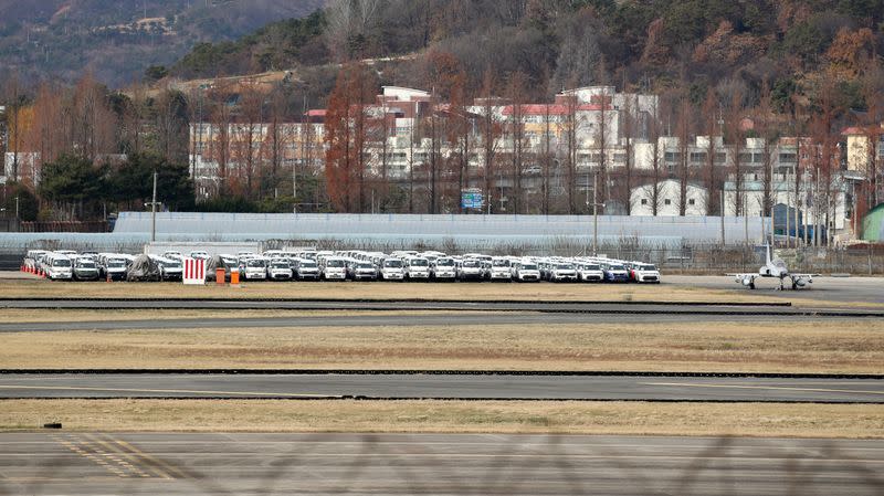 Finished vehicles are parked and wait to be delivered at an airport due to the nationwide strike by truckers in Gwangju