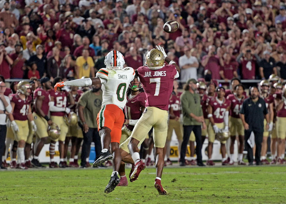 Nov 11, 2023; Tallahassee, Florida, USA; Florida State Seminoles defensive back Jarrian Jones (7) intercepts the ball to close out the game against the Miami Hurricanes at Doak S. Campbell Stadium. Mandatory Credit: Melina Myers-USA TODAY Sports