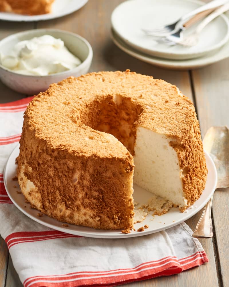 Tube pan-shaped angel food cake with wedge cut out to show interior