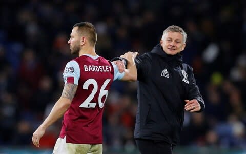 Burnley's Phil Bardsley shakes hands with Manchester United manager Ole Gunnar Solskjaer  - Credit: REUTERS