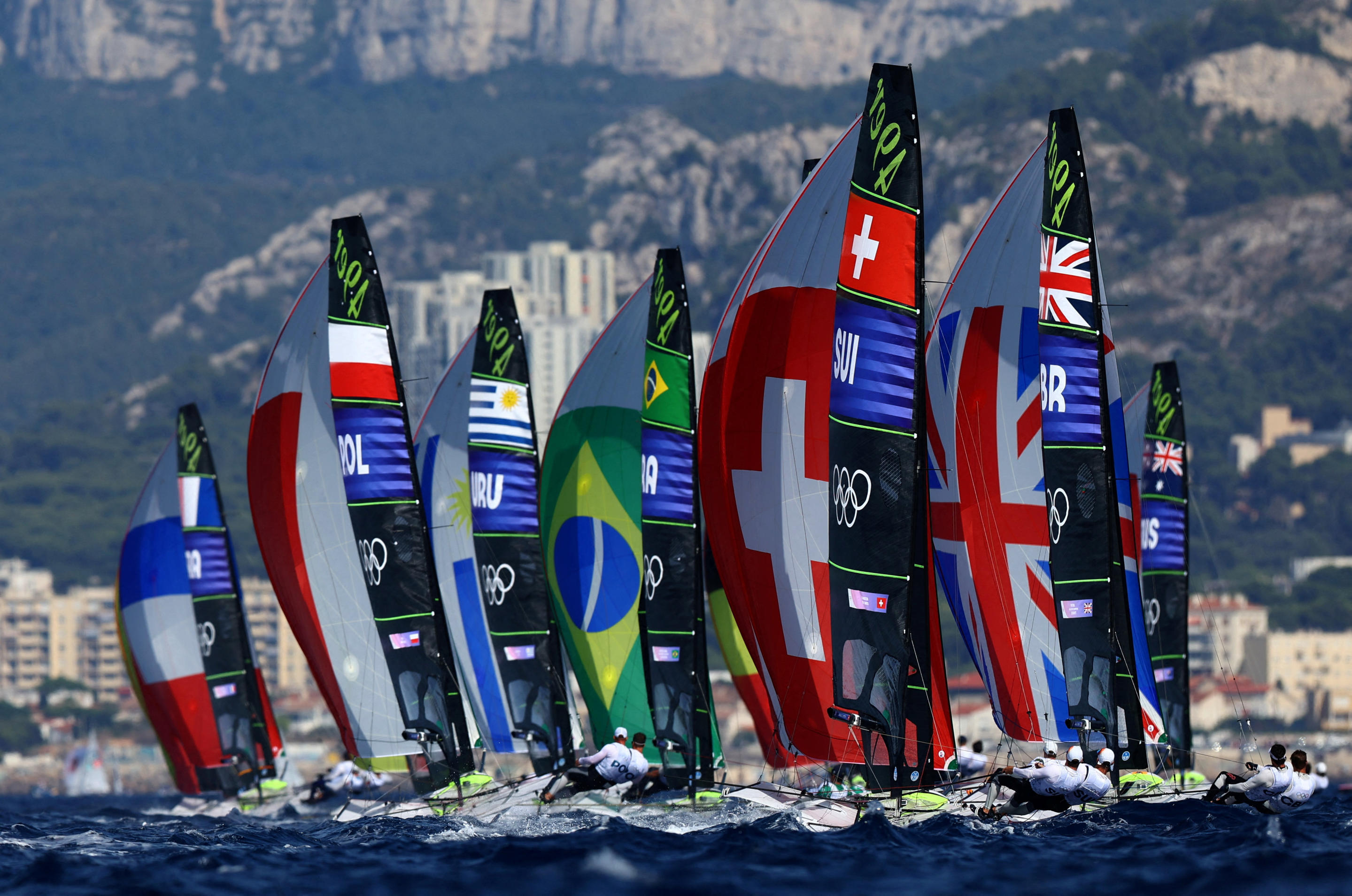 A half dozen boats in action during the men's skiff sailing competition in Marseille.