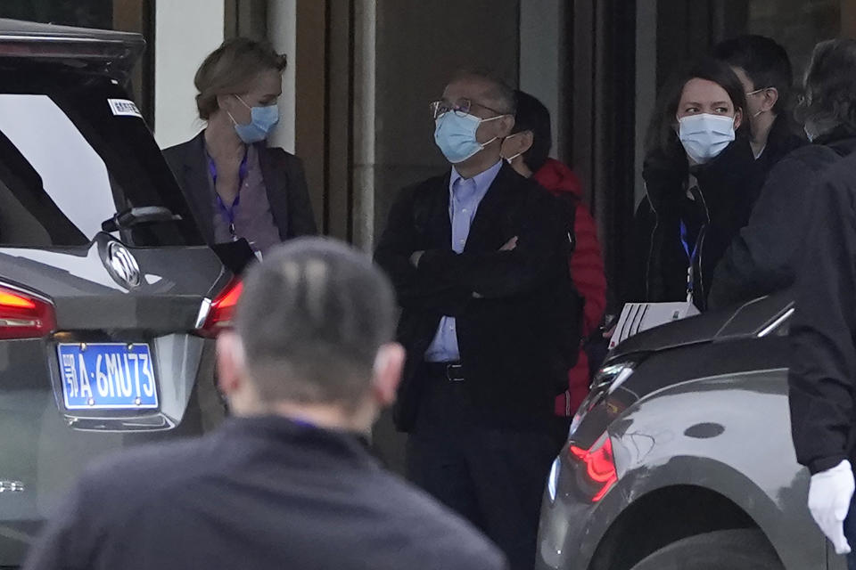 Members of the World Health Organization team including Ken Maeda, center, prepare to leave for a second day of field visit in Wuhan in central China's Hubei province on Saturday, Jan. 30, 2021. (AP Photo/Ng Han Guan)