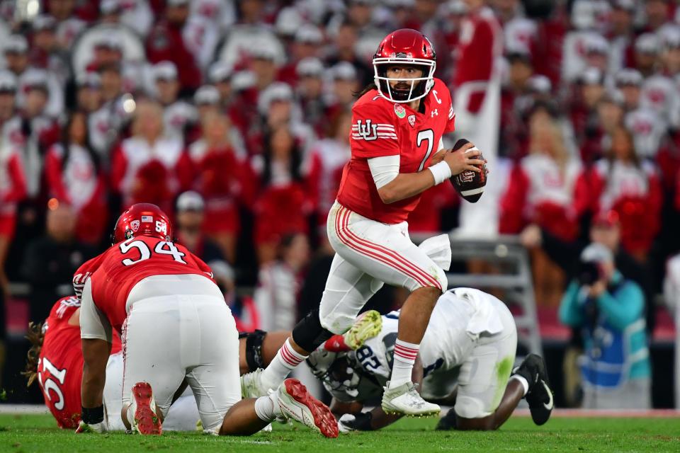 Utah quarterback Cameron Rising looks upfield after avoiding the Penn State pass rush in the second half of the 109th Rose Bowl game. The Newbury Park High graduate suffered a knee injury in the third quarter that kept him sidelined for the entire 2023 season.