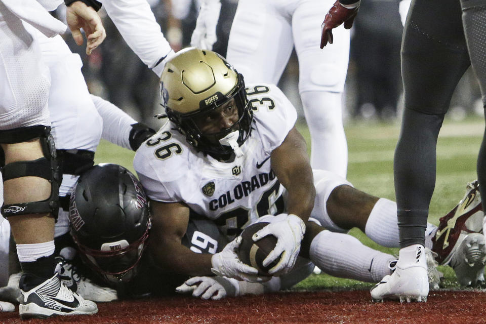 Colorado running back Sy'veon Wilkerson (36) scores a touchdown during the second half of an NCAA college football game against Washington State, Friday, Nov. 17, 2023, in Pullman, Wash.(AP Photo/Young Kwak)