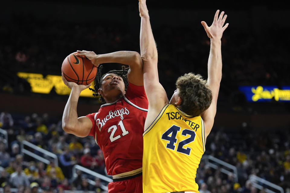 Ohio State forward Devin Royal (21) shoots on Michigan forward Will Tschetter (42) in the first half of an NCAA college basketball game in Ann Arbor, Mich., Monday, Jan. 15, 2024. (AP Photo/Paul Sancya)