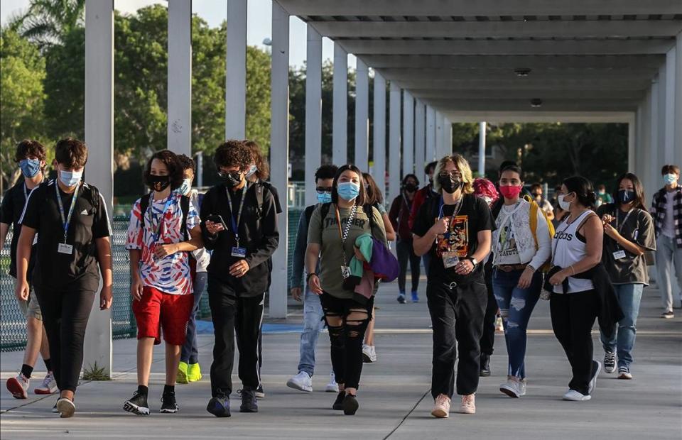 Broward Cypress Bay High School students enter campus as they returned to school under a school board mask mandate on Wednesday, Aug. 18, 2021. The 2021-2022 school year in Miami-Dade and Broward was the first year back to classroom learning for all students, after two years of remote learning for many students due to the pandemic.