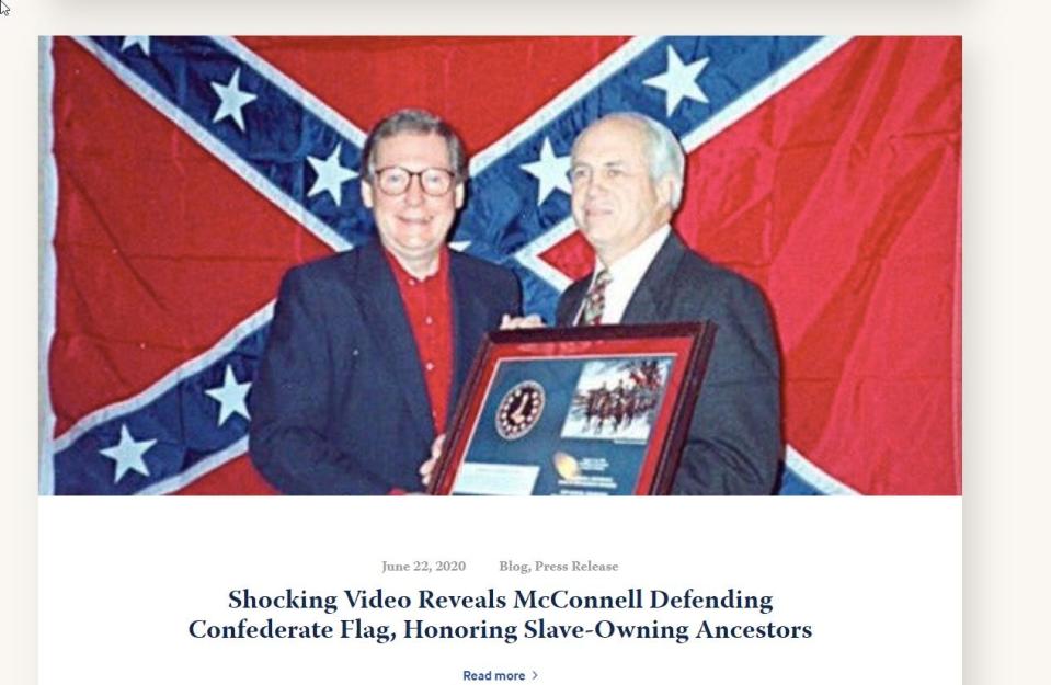 A screen capture from a Kentucky Democratic Party blog shows a picture of Senate Majority Leader in front of a Confederate battle flag. The picture, taken decades ago, is often shared on social media by McConnell critics.