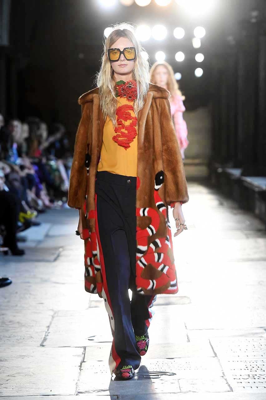 <p>Pajama dressing goes best with bedhead and a robe-like fur coat with Gucci’s signature serpent motif.</p><p><i>Photo: Getty</i></p>