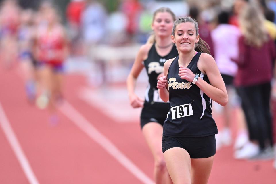 Penn’s Mary Eubank (797) and Ellie Stabnik lead the 3200 meter run at the Mishawaka Girls IHSAA Sectional track meet Tuesday, May 17, 2022, at Mishawaka High School.