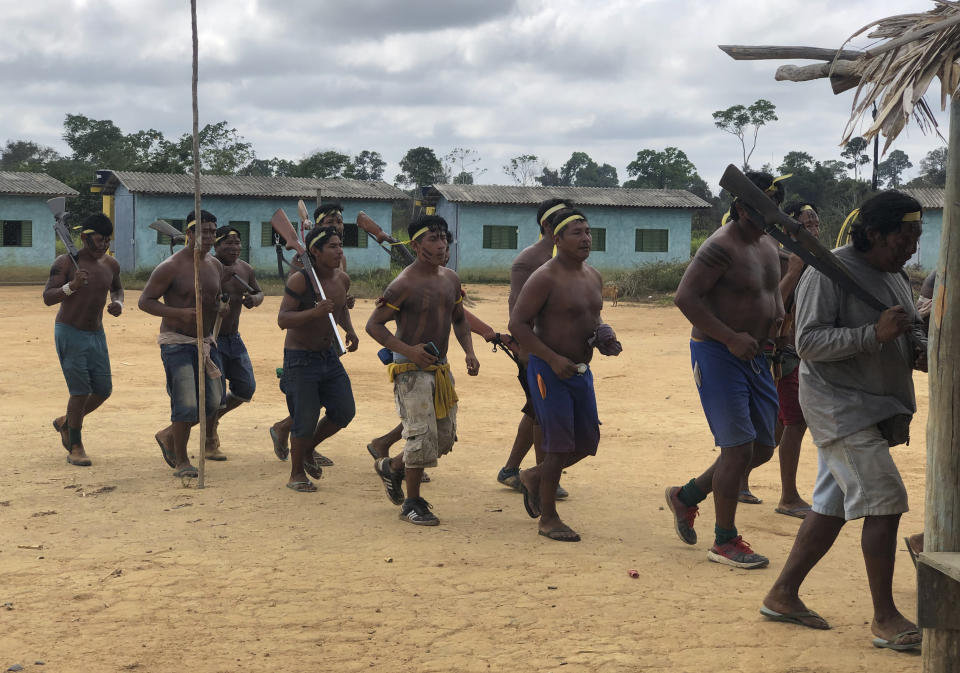 Indigenous Xikrin warriors return from a failed attempt to expel land squatters from the Trincheira Bacaja Indigenous Indigenous territory, in Brazilian Amazon, Para state, Brazil, Aug. 24, 2019. Brazil's government on Monday, Oct. 2, 2023, began removing non-indigenous people from two Indigenous territories in a move that will affect thousands living in the Amazon rainforest's heart. (AP Photo/Fabiano Maisonnave)