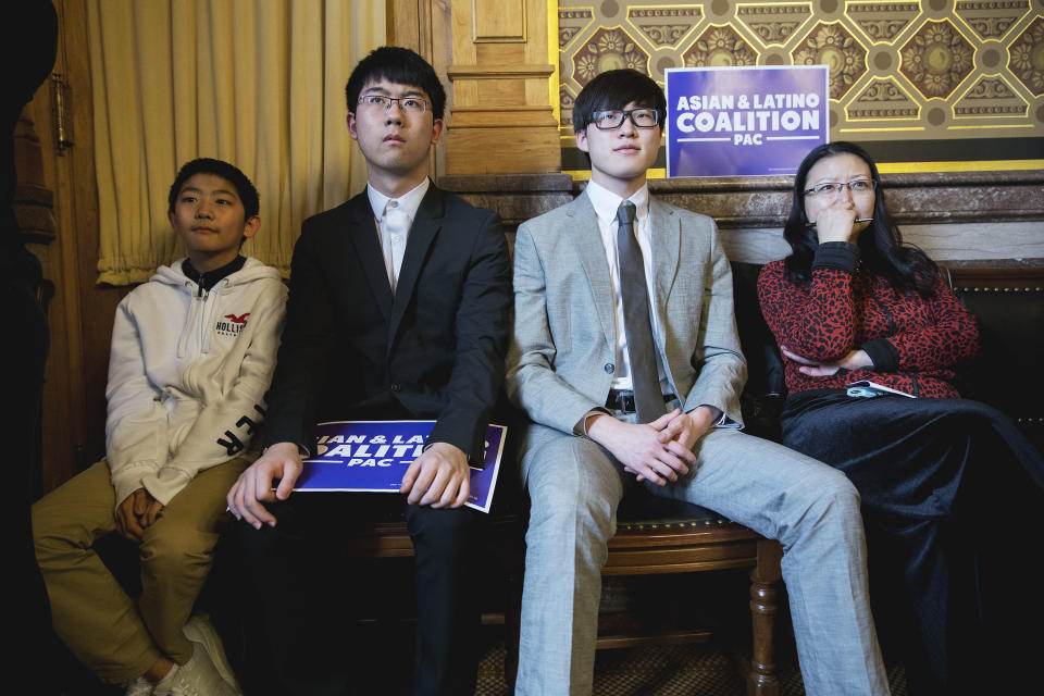 Kevin Wang, 13, Klein Wang, Harvey Ma and Feng Xue listen to a speech by Garcetti during his visit with the Iowa Asian & Latino Coalition PAC in in Des Moines on April 13. (Photo: KC McGinnis for Yahoo News)