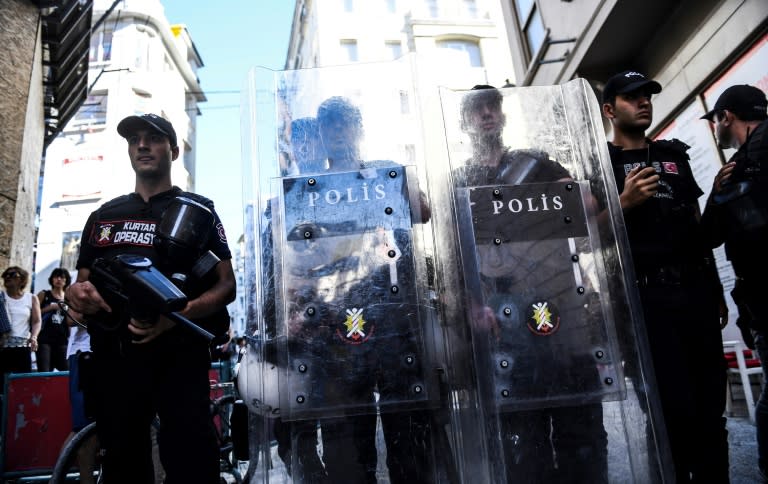 Turkish riot police officers block a road to prevent LGBT rights activists from going ahead with an annual Gay Pride parade. The Istanbul governor's office banned the parade citing safety and public order concerns