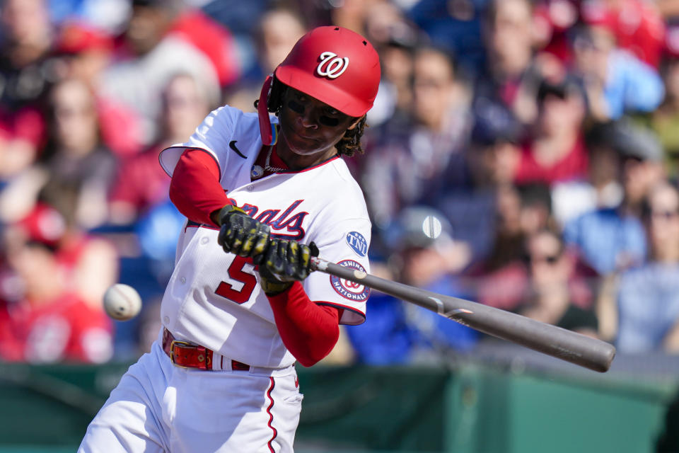 Washington Nationals' CJ Abrams hits a double during the fifth inning of a baseball game against the Detroit Tigers at Nationals Park, Saturday, May 20, 2023, in Washington. (AP Photo/Alex Brandon)