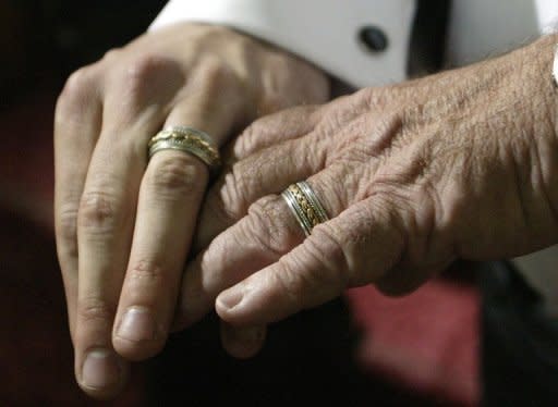 A male couple show their wedding rings to the media after a ceremony in Toronto, Canada. Currently, The Netherlands, Belgium, Canada, South Africa, Argentina, Spain, Portugal, Norway, Sweden, Denmark, Iceland and Uruguay allow same-sex marriage