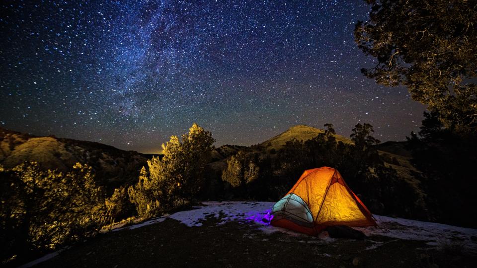 Camping in a Tent Under the Stars and Milky Way Galaxy