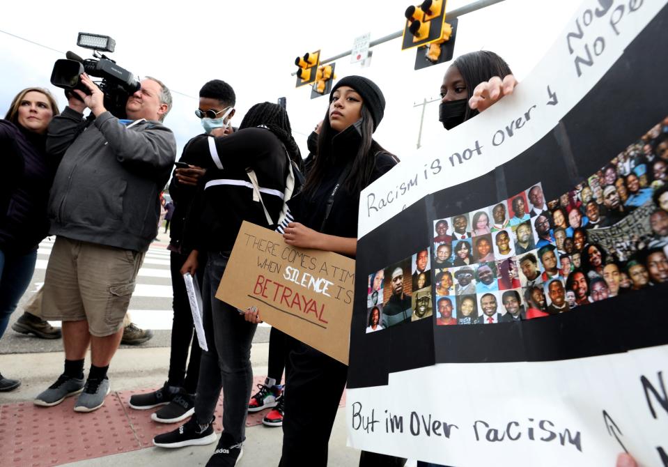 Students listen to their classmates being interviewed by the media in front of Bloomfield Hills High School on Nov. 12, 2021, after over 300 walked out at 1:30 pm to rally and protest the ongoing racist and homophobic atmosphere going on at the high school.
Several students spoke using a bullhorn to the crowd to demand action and for the administration to do something about it.