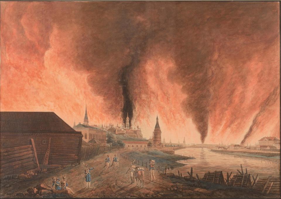 A painting of Moscow on fire as the Napoleonic army approaches.